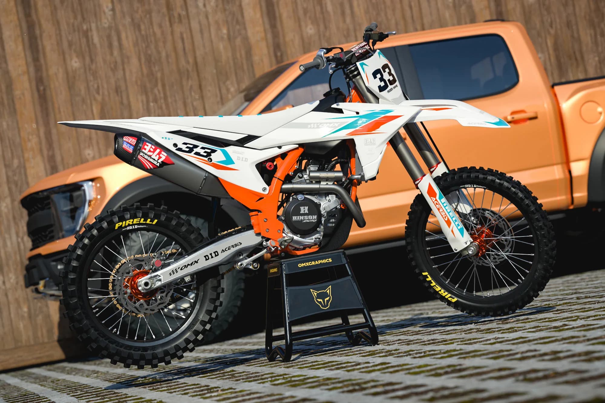 OMX Graphics Glitch motocross graphics kit in orange and teal on a KTM dirt bike